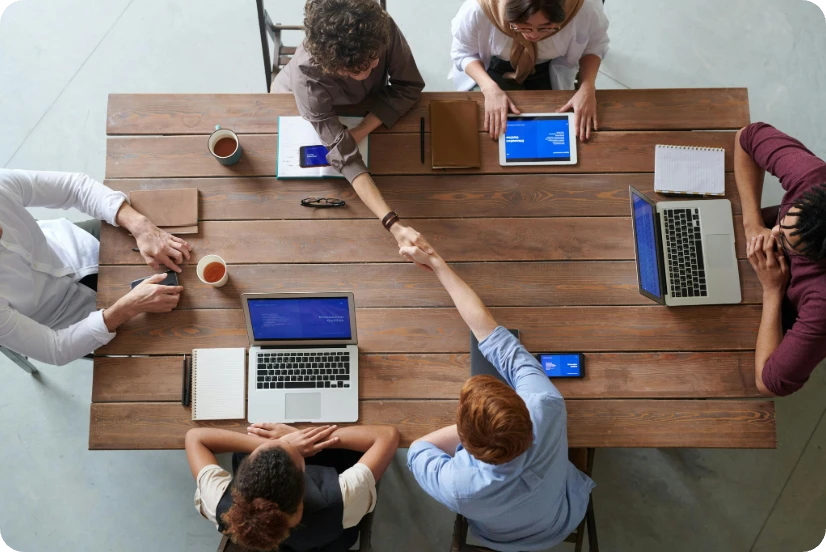 a group of peopel holding a meeting