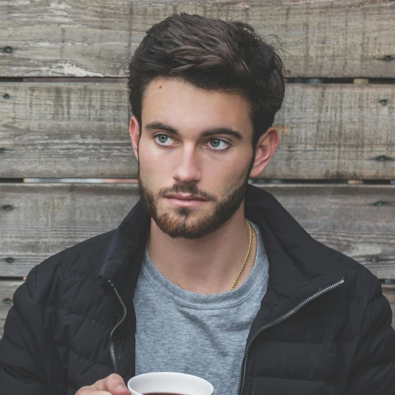 a man leaning on the wall