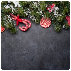 black christmas background with red candy cane