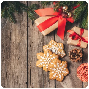 christmas gift box background with snow shape cookies on the floor